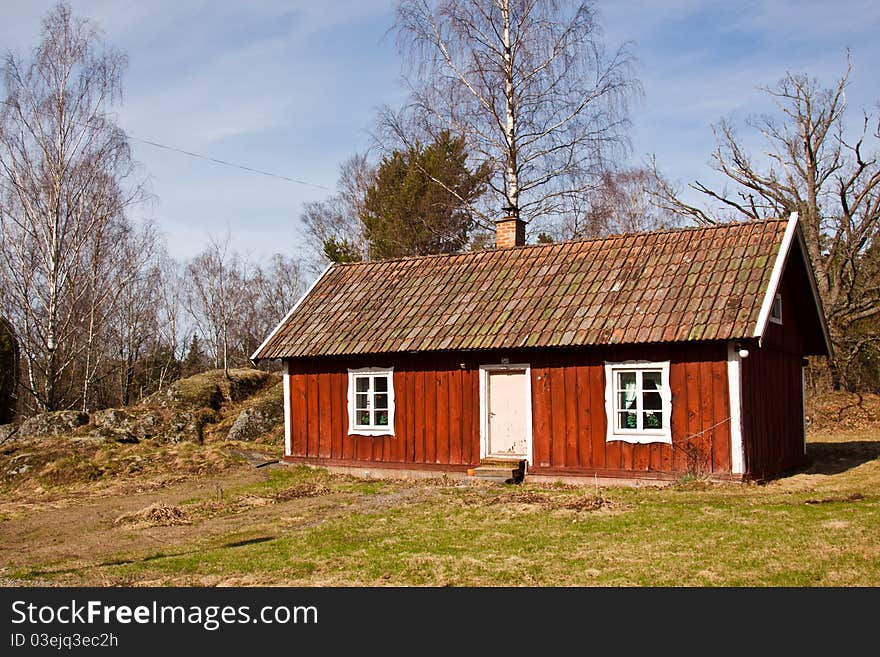 A red old typical summer house in Sweden. A red old typical summer house in Sweden.