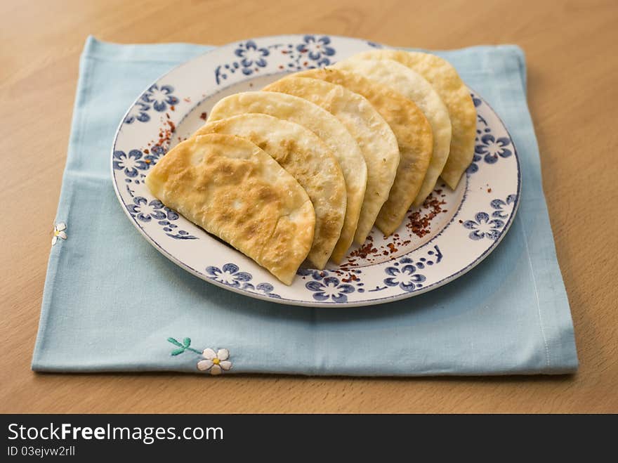 The Tatar meal, pies fried with forcemeat yogurt.