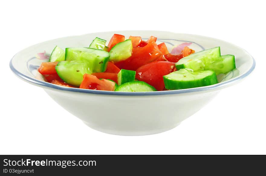 Closeup of fresh salad with dressing in bowl