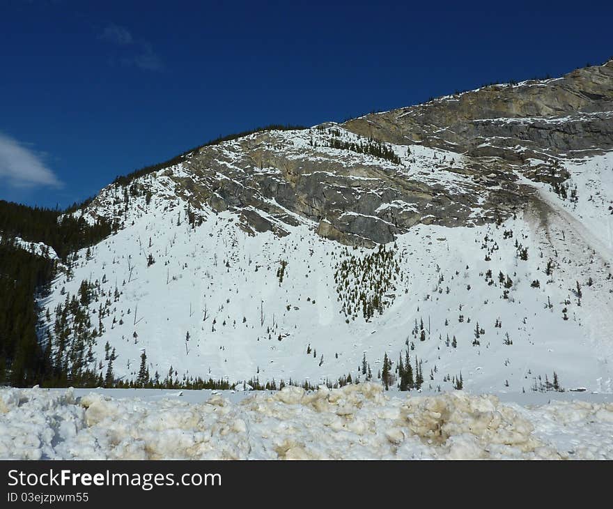 Beautiful snowy mountains in the blue skies of Jasper National Park Canada. Beautiful snowy mountains in the blue skies of Jasper National Park Canada