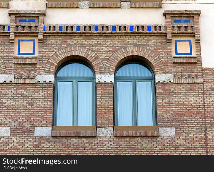 An old brick building with arched windows. An old brick building with arched windows