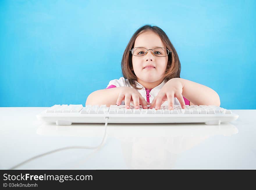 A little girl chatting in internet