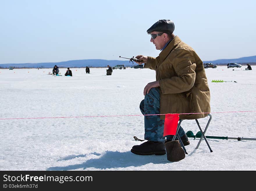 The fisherman on winter fishing