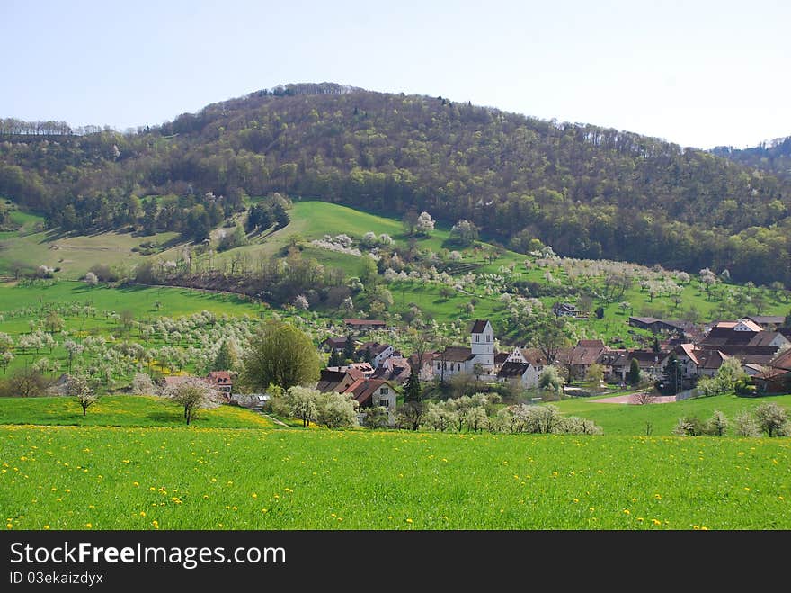 Swiss farming village in rural early spring setting. Swiss farming village in rural early spring setting