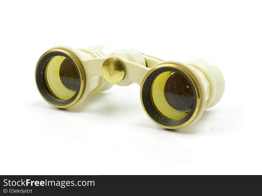 The old opera glasses on a white background