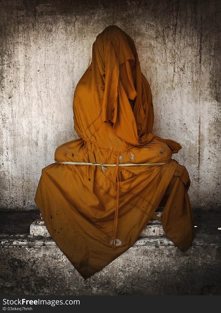 Buddha image covered with a cloth While being repaired