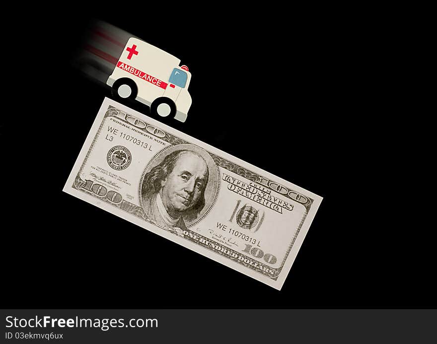 Blurry ambulance on money