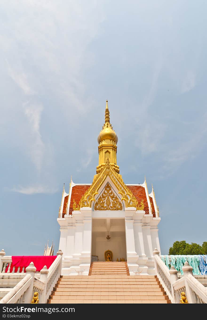 The temple golden roof and red, white building