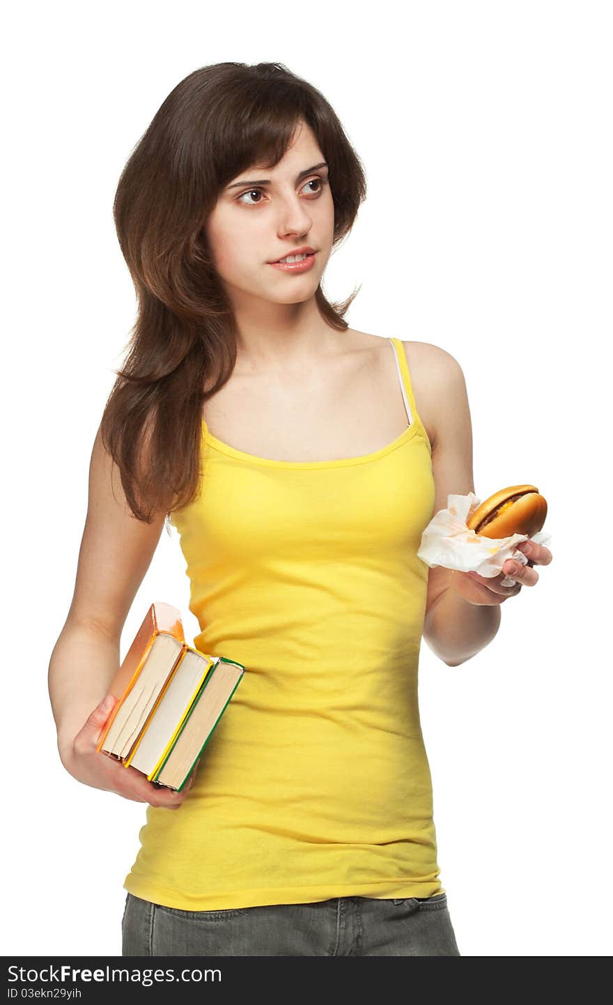 Young girl with books and hamburger isolated in white