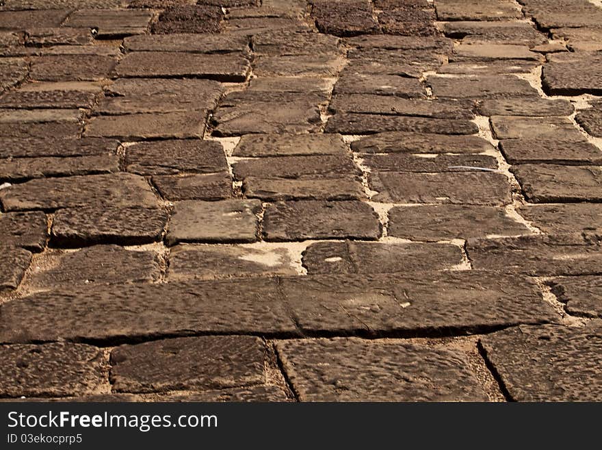 Old ruined paving blocks background