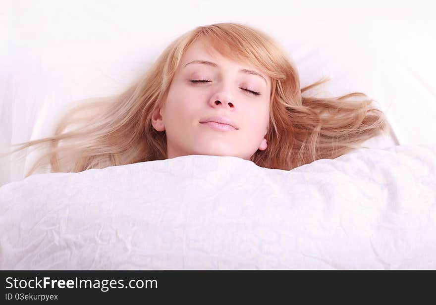 Portrait of young beautiful woman in bed. Portrait of young beautiful woman in bed