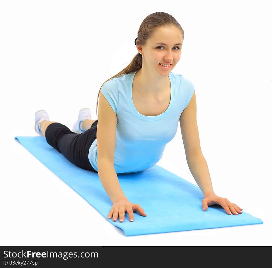 The beautiful young woman plays sports on a white background