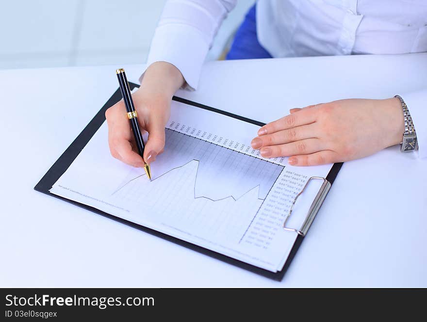 Business woman working with documents in the office. Business woman working with documents in the office