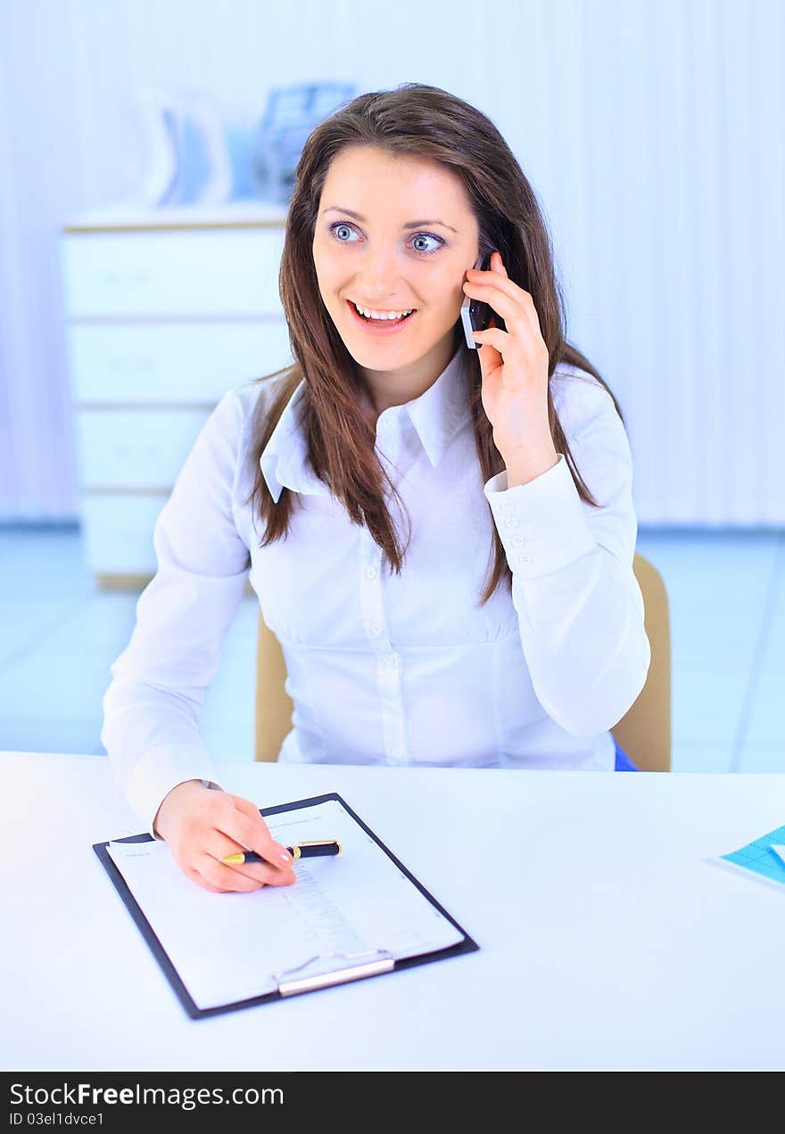 The beautiful business woman at office