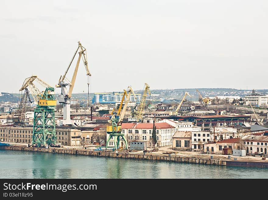 Powerful shipbuilding shipyard with a pier and cranes