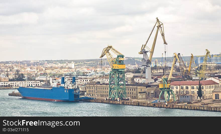 Powerful shipbuilding shipyard with a pier and cranes