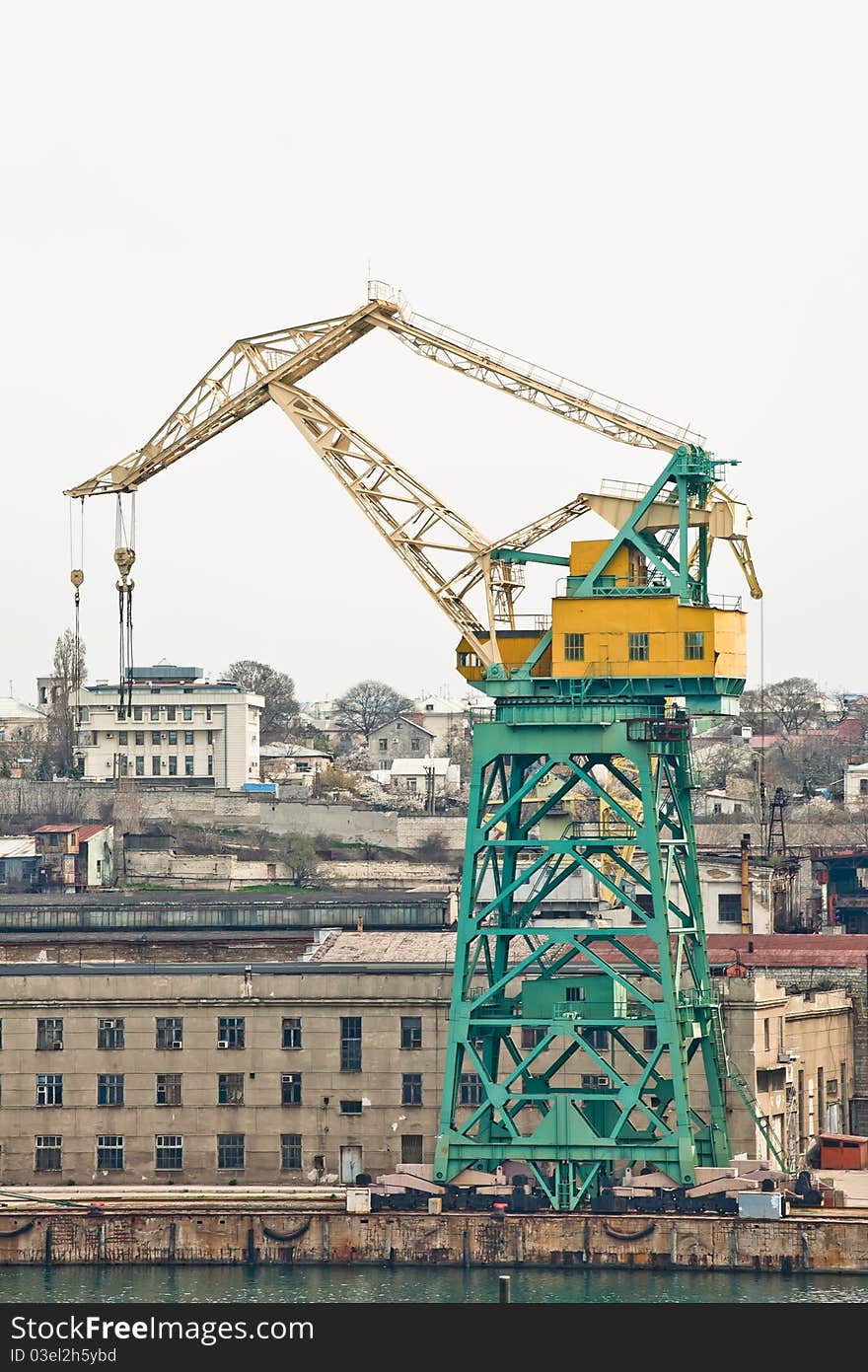 Powerful shipbuilding shipyard with a pier and cranes