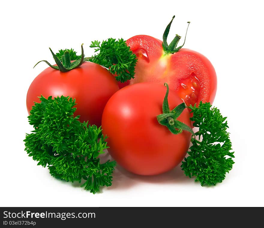 Half of redfresh tomato with green leafs isolated on white background. Half of redfresh tomato with green leafs isolated on white background