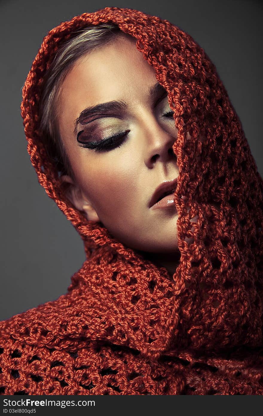 Beauty young woman with colorful makeup on a gray background. Beauty young woman with colorful makeup on a gray background