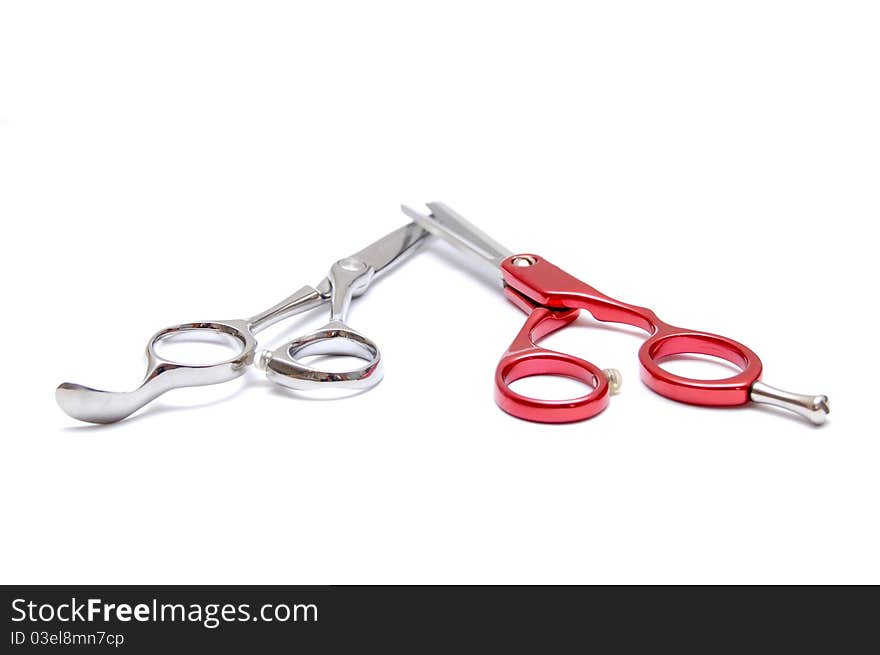 Pair of scissors for hairdressers on a white background