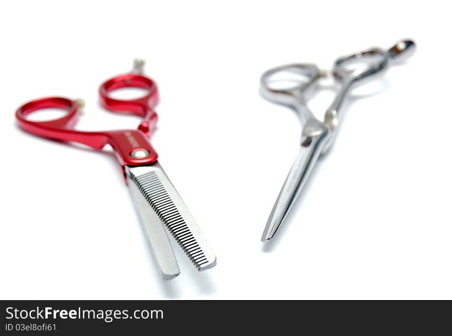 Pair of scissors for hairdressers on a white background