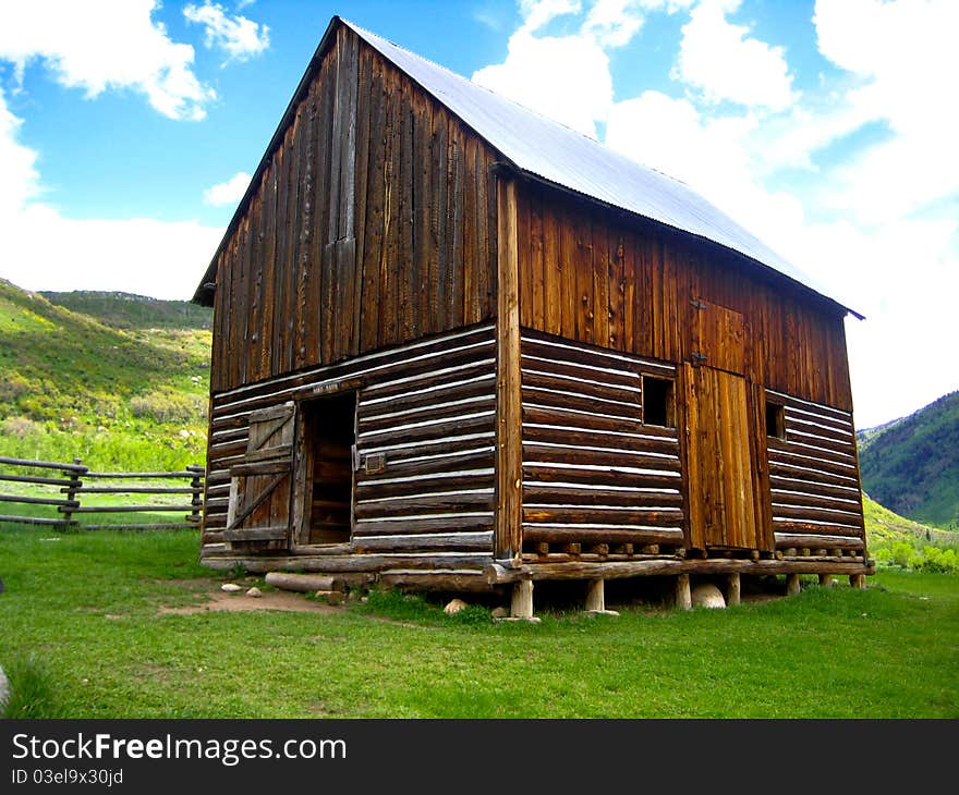 Old abandoned log cabin in the mountains