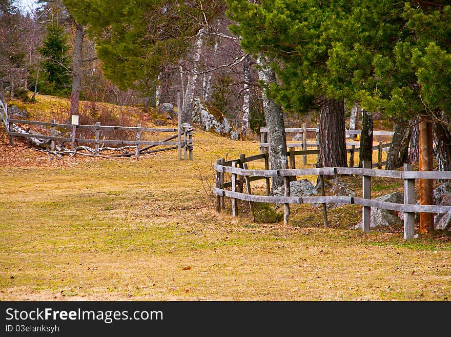 A wooden fence on a field