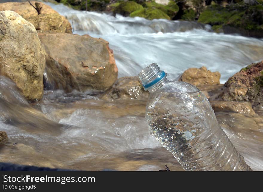 Spring water and plastic bottle