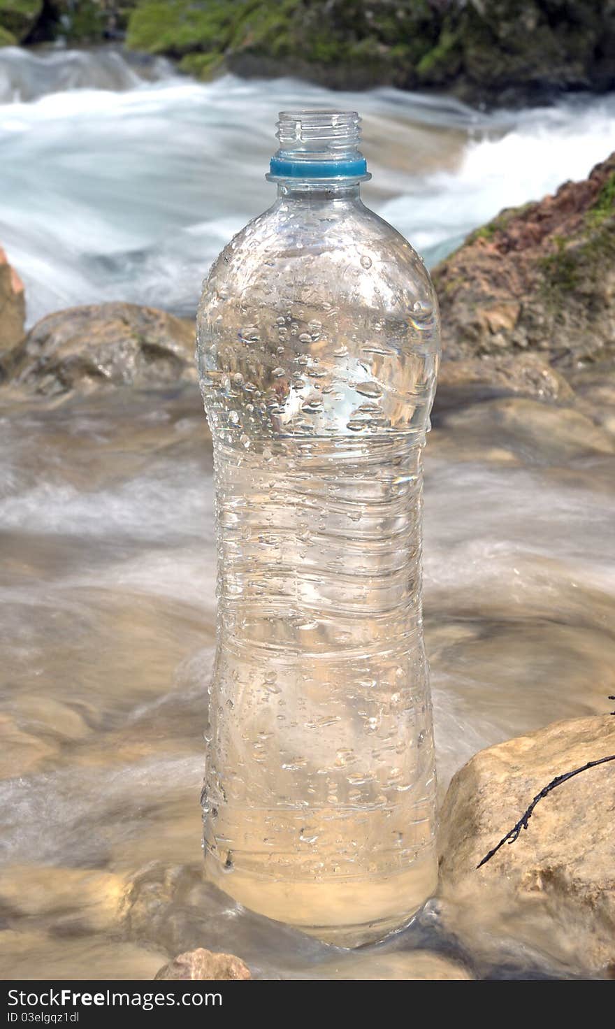 Spring water and plastic bottle