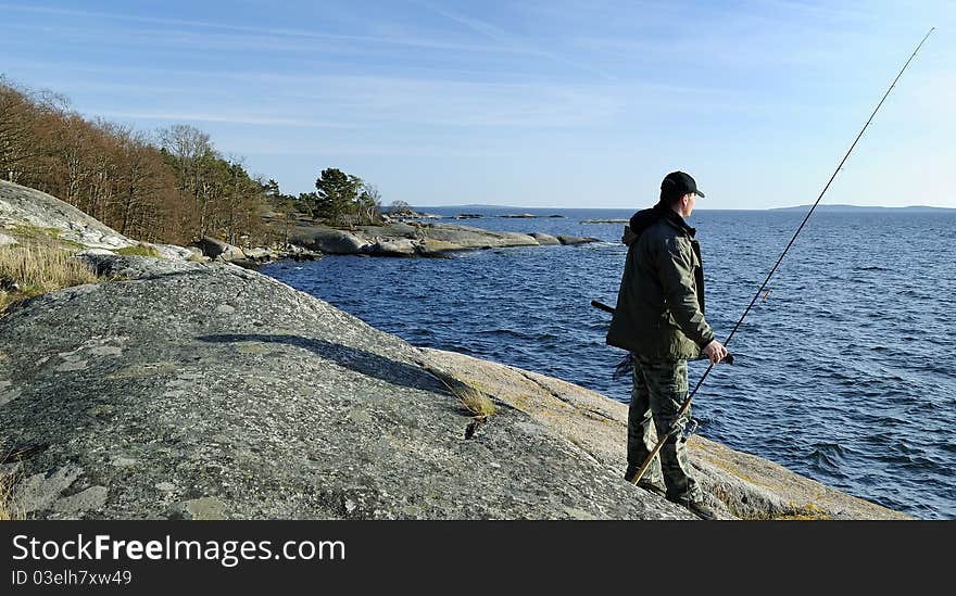 Angler on a coast