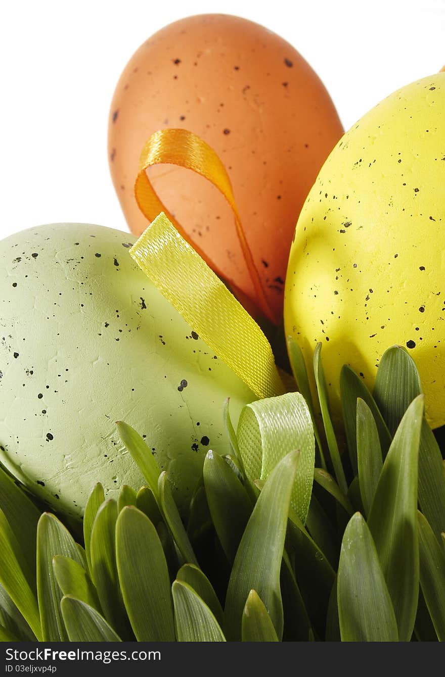 Colorful traditional Easter decoration with grass and artificial eggs