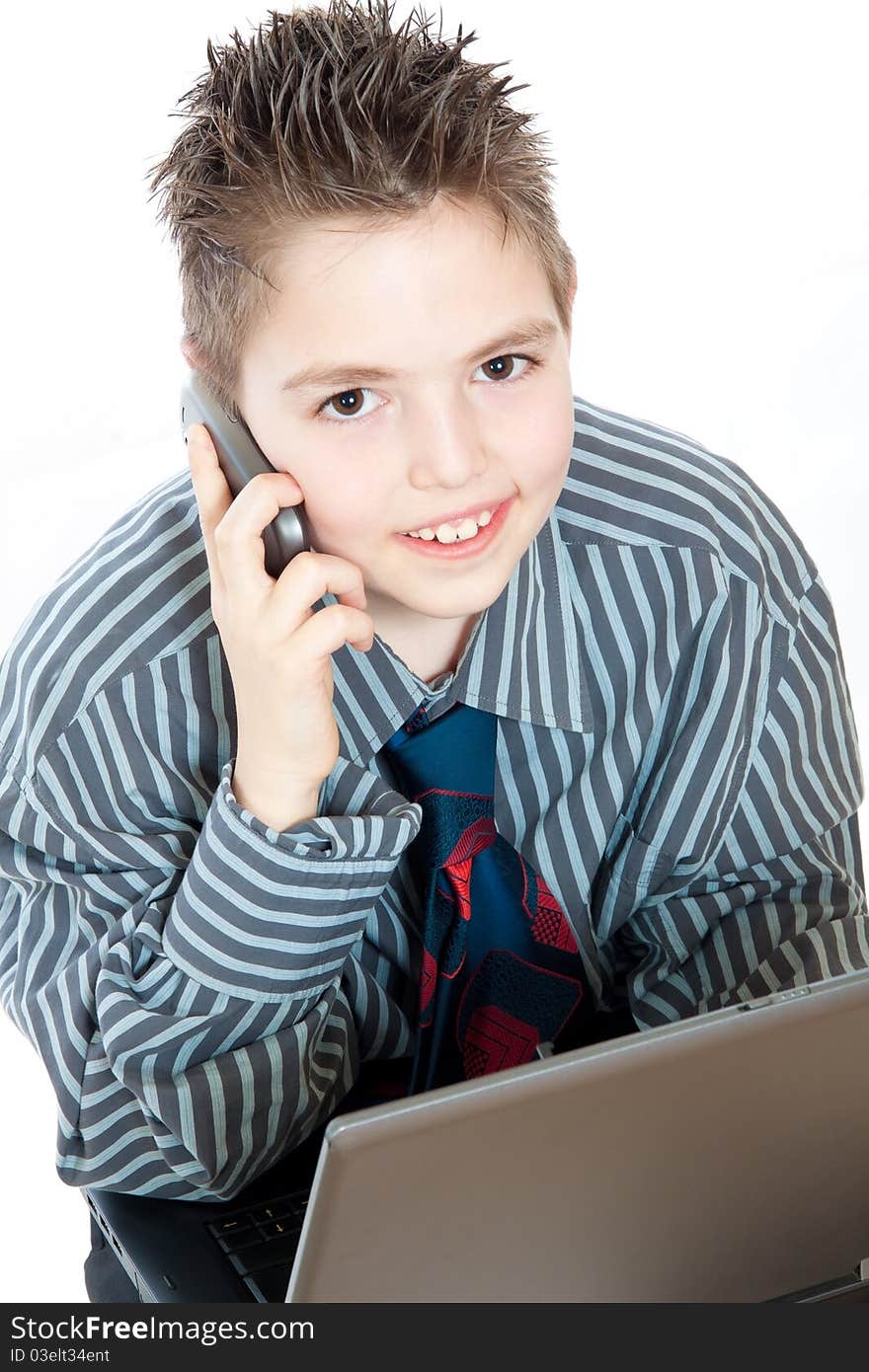 Portrait of a business boy with mobile and laptop. Portrait of a business boy with mobile and laptop