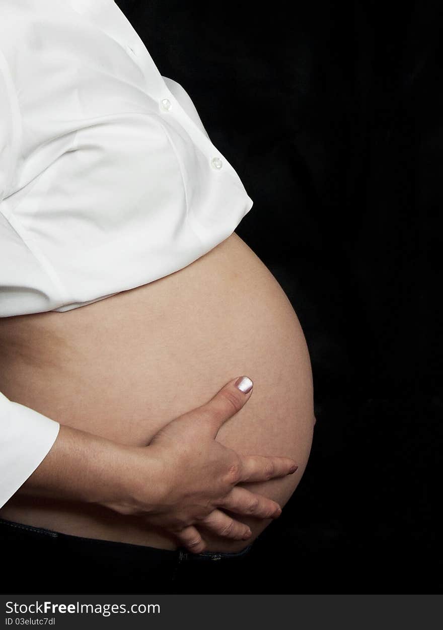 Body shot of a pregnant woman. Body shot of a pregnant woman