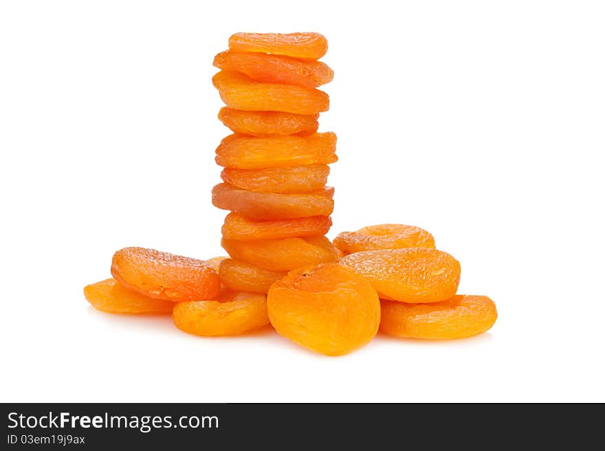 Pyramid of dried apricots. Isolated on white background.