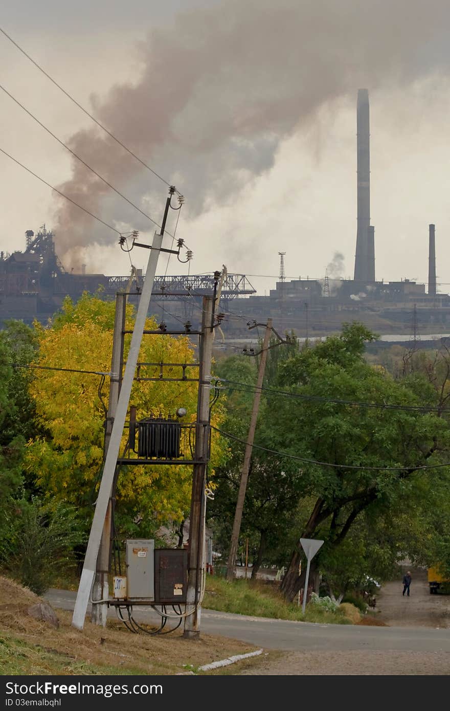 Large metallurgical factory destroying the nature with smoke and waste. Large metallurgical factory destroying the nature with smoke and waste