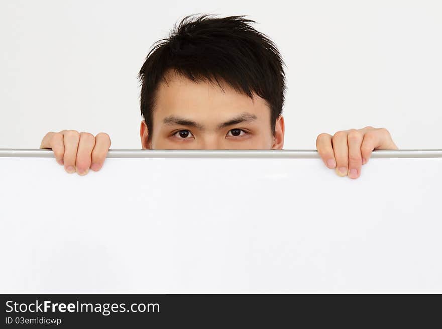 Man Looking Over a Board