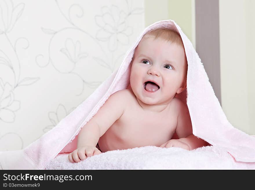 Sweet baby boy with towel