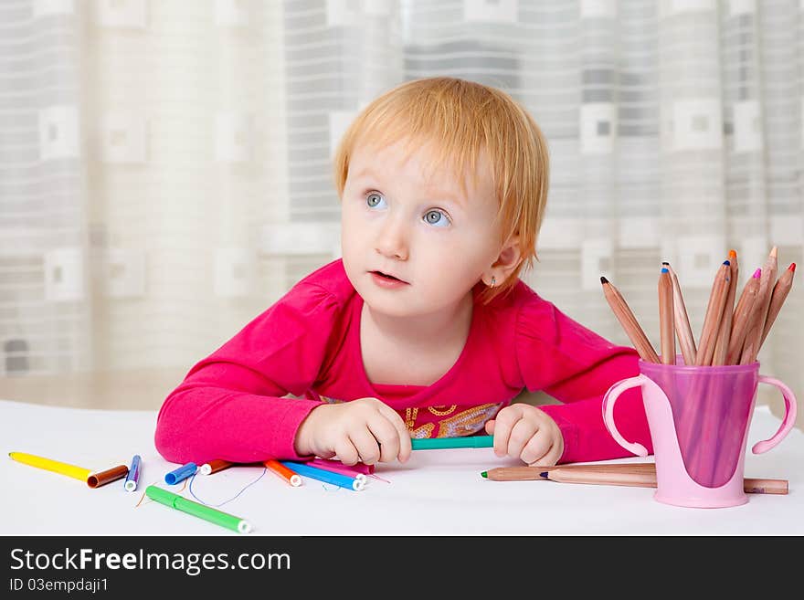 Kid drawing picture at home