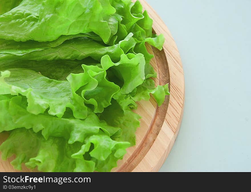 Fresh green salad on the breadboard