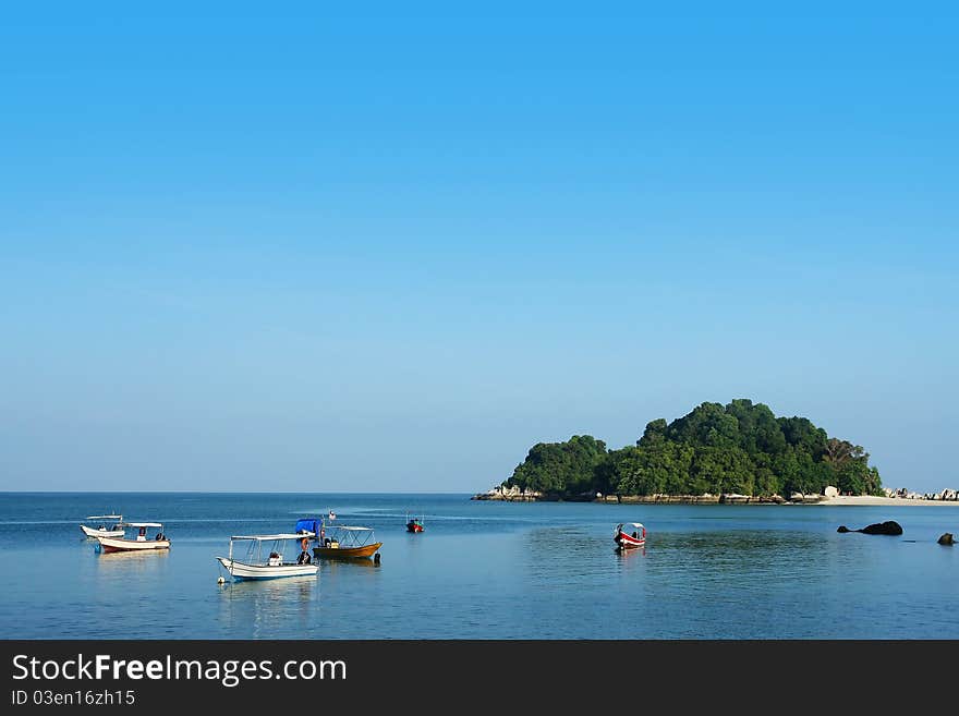 Small Island And Boat