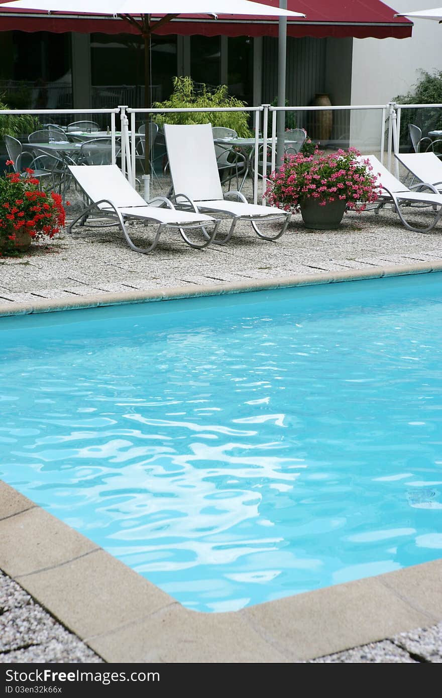 Furniture recliner gardens around a pool