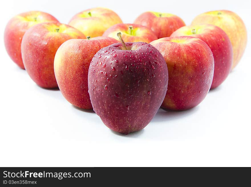 Red apples arranged on a white background.