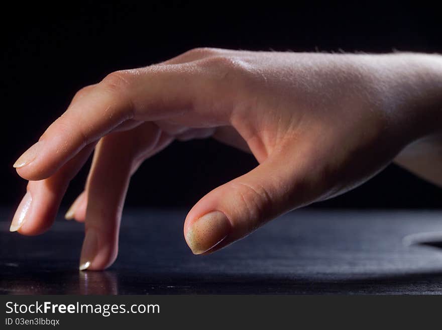 Hand in a young woman in the foreground