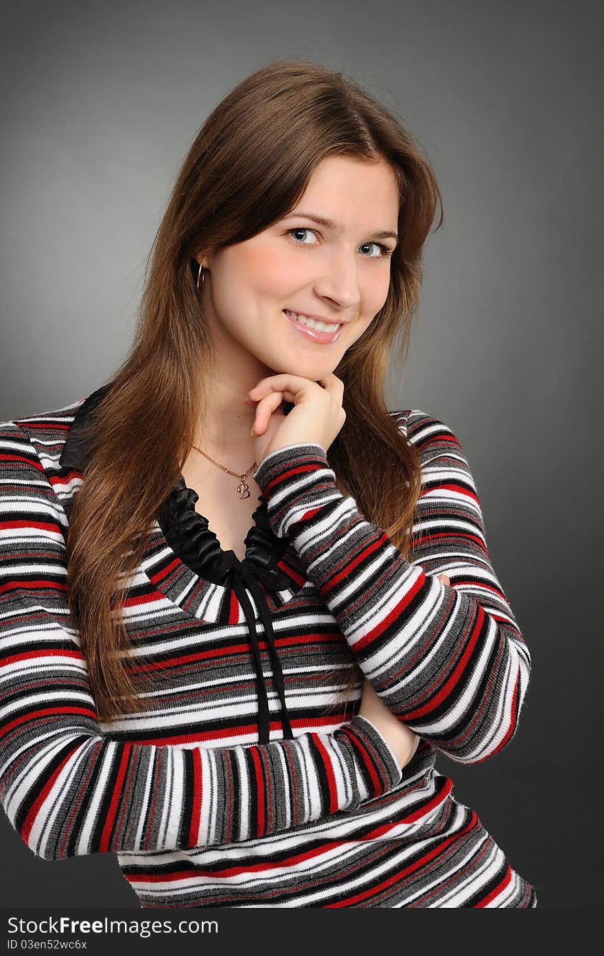 Portrait of the attractive woman on a grey background. Portrait of the attractive woman on a grey background