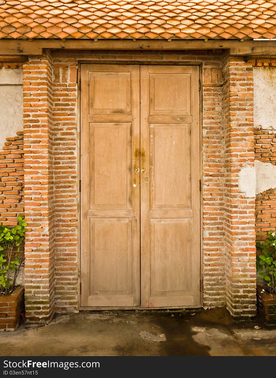 Grunge door background with brick wall. Grunge door background with brick wall