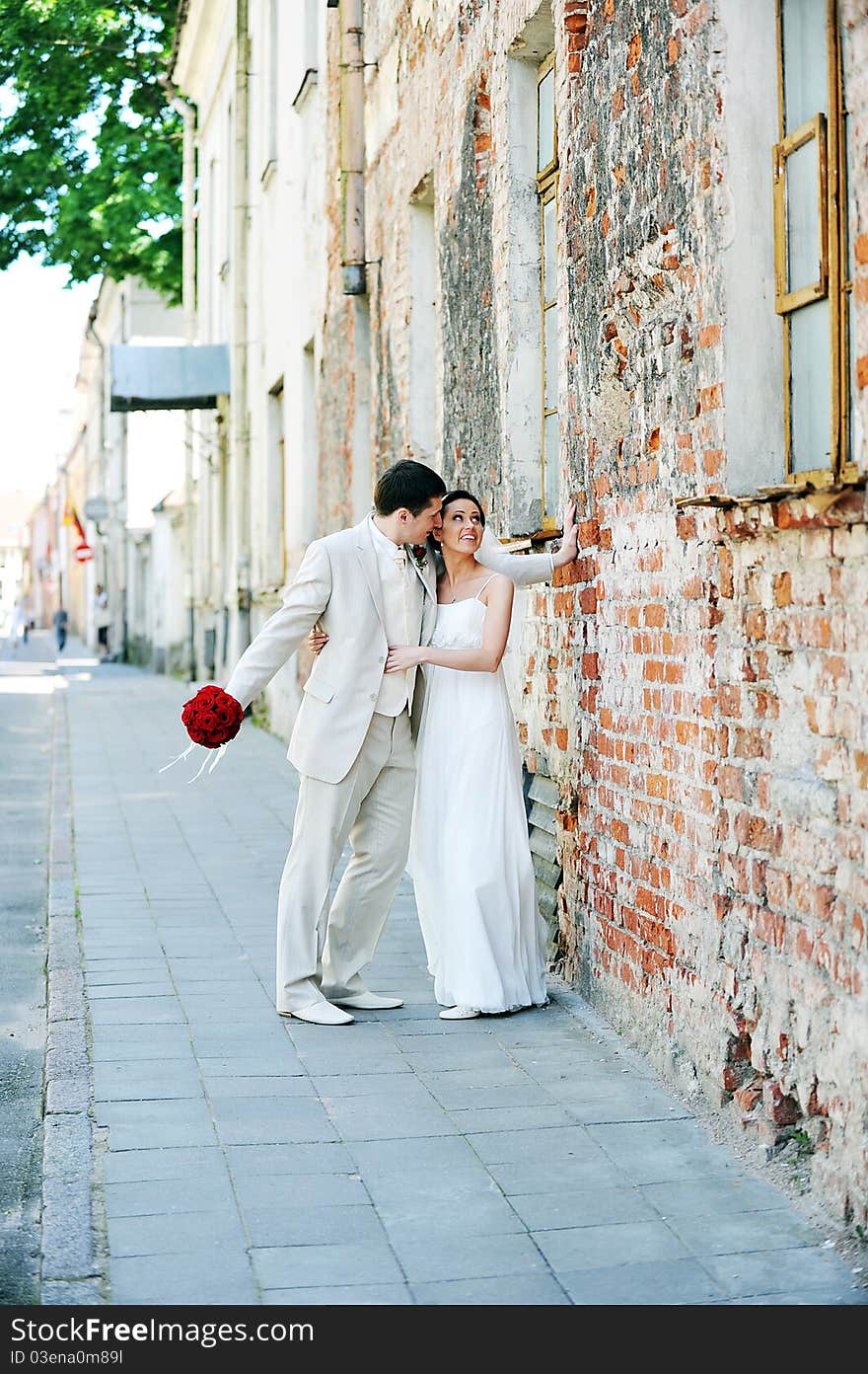 Bride and groom for an old brick wall. Bride and groom for an old brick wall