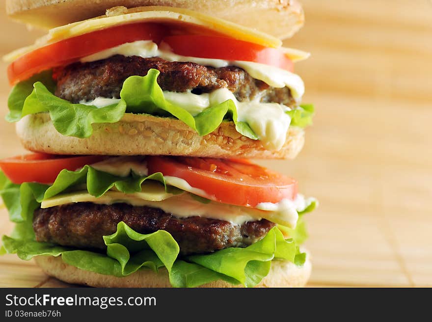 Hamburger with cutlet and vegetables close up