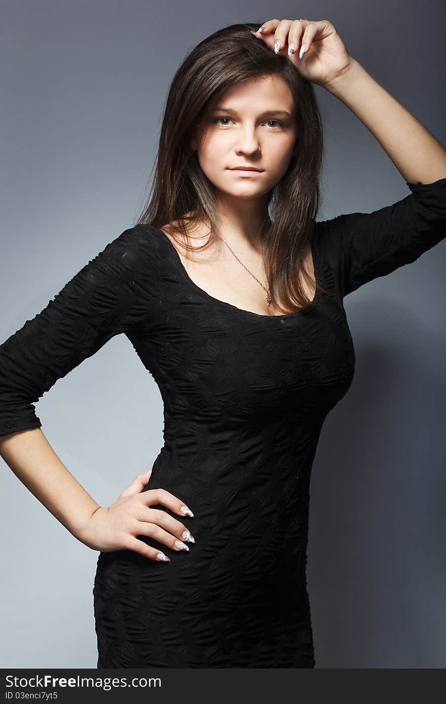 Studio portrait of pretty fashionable girl