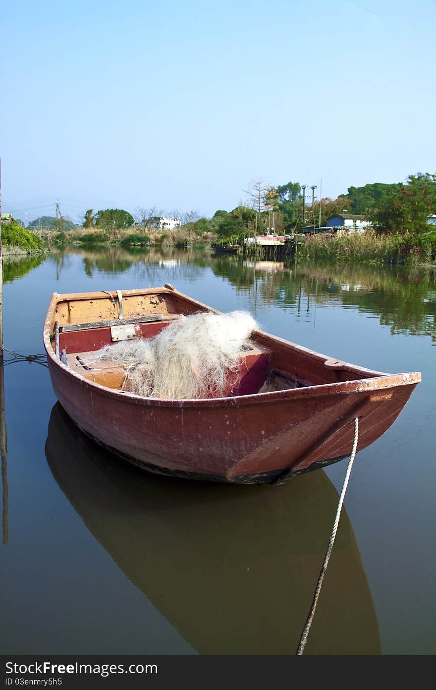 An empty boat on a lake. An empty boat on a lake.