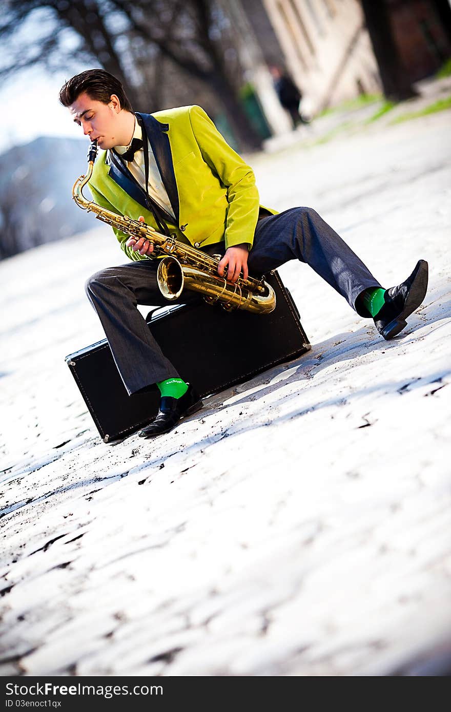 Man with a saxophone on the street